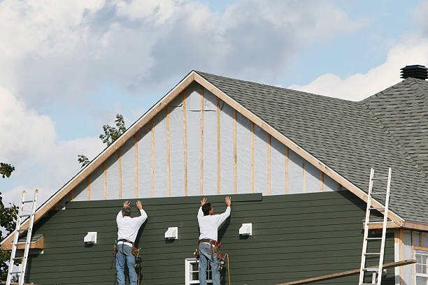 Professional Storm Damage Siding Repair technician working in McHenry, IL